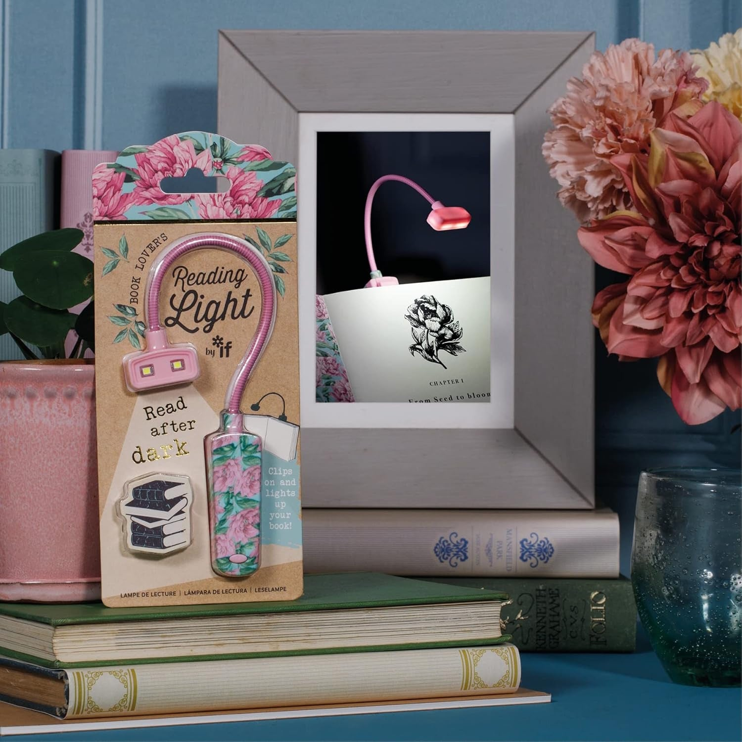 Book Lover Reading Lights - Floral Book Light resting on a stack of books