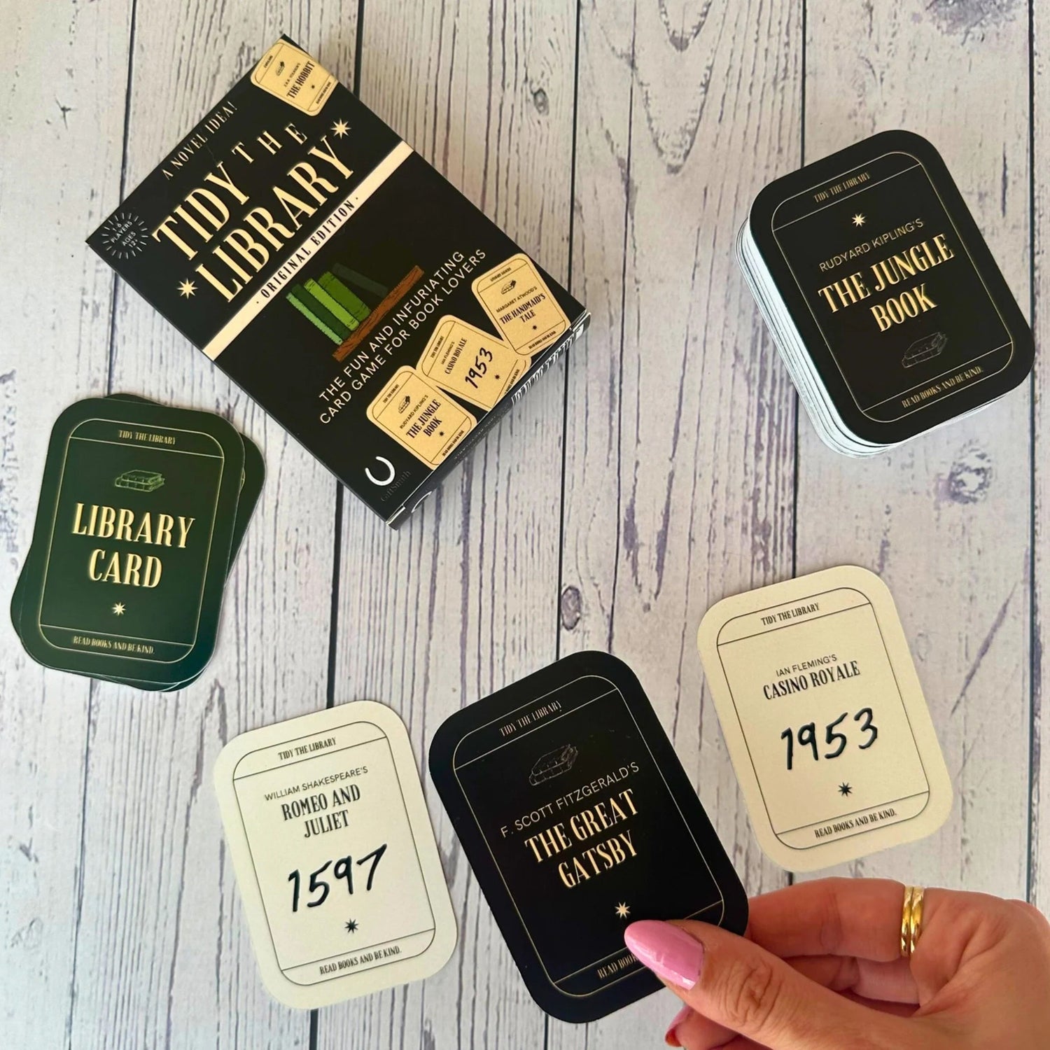 Fun & Games - Tidy the Library Card Game on a wooden surface