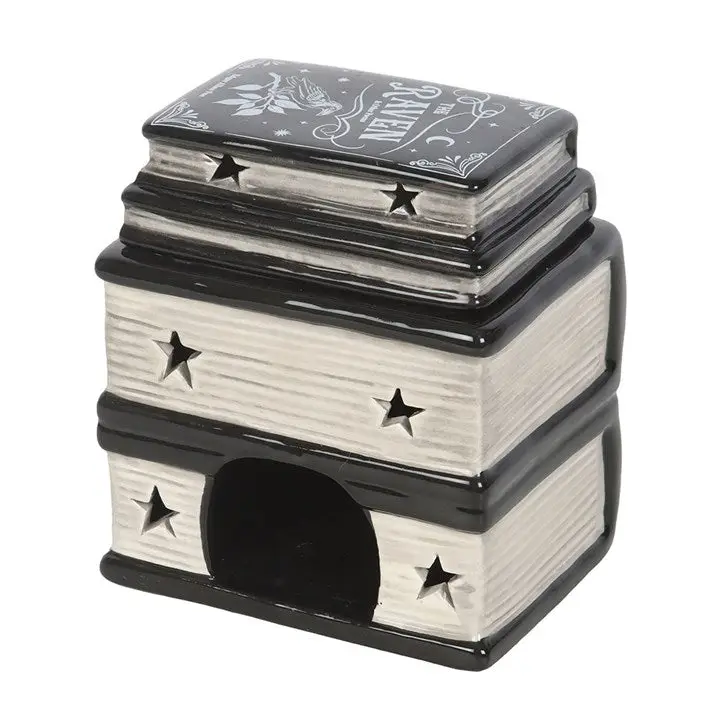 Decorative item resembling a stack of books with star patterns on a white background