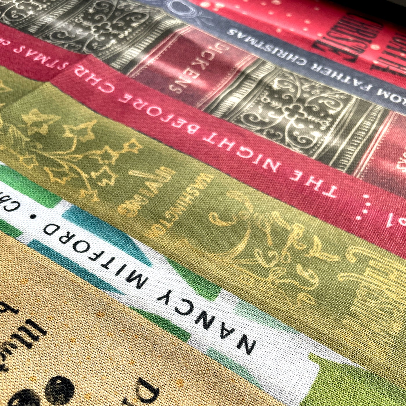 Close-up of book spines with decorative text and colors.
