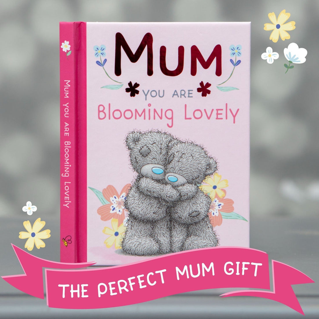 Pink book with wording: Mum you are blooming lovely and teddy bears on front with a grey and floral background
