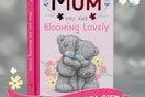 Pink book with wording: Mum you are blooming lovely and teddy bears on front with a grey and floral background