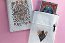 Wuthering Heights Book Sleeve with quote text and flowers and book, set on pink background