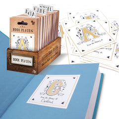 Letter Book Plates - Letter C Book Plate stuck to a blue book page