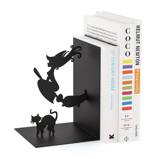 Black metal bookend shaped like a cat and dog holding a book titled 'Coco' 