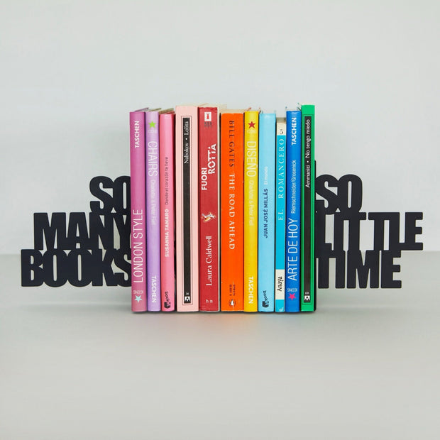 Stack of books with colourful spines on a white background, flanked by black  bookends cutout text 'SO MANY BOOKS' and 'SO LITTLE TIME'.
