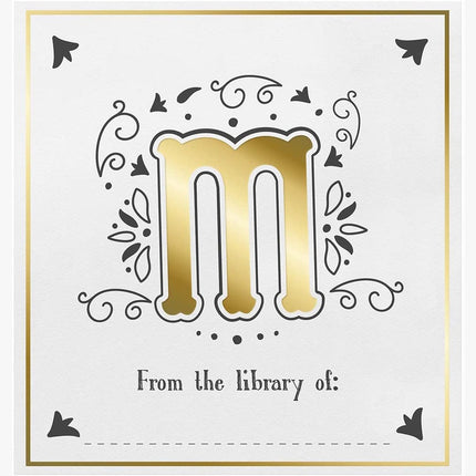 Decorative bookplate with gold letter 'm' and decorative elements on a white background.