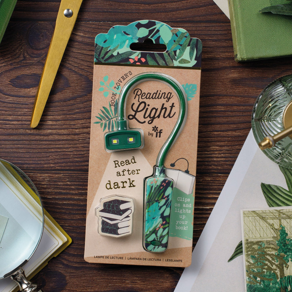Reading light clip on packaging with decorative elements on a wooden surface