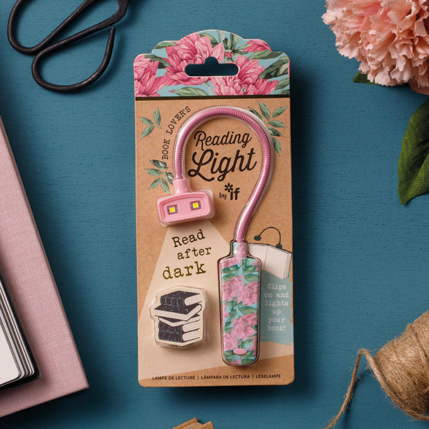 Floral reading light with packaging on a blue background