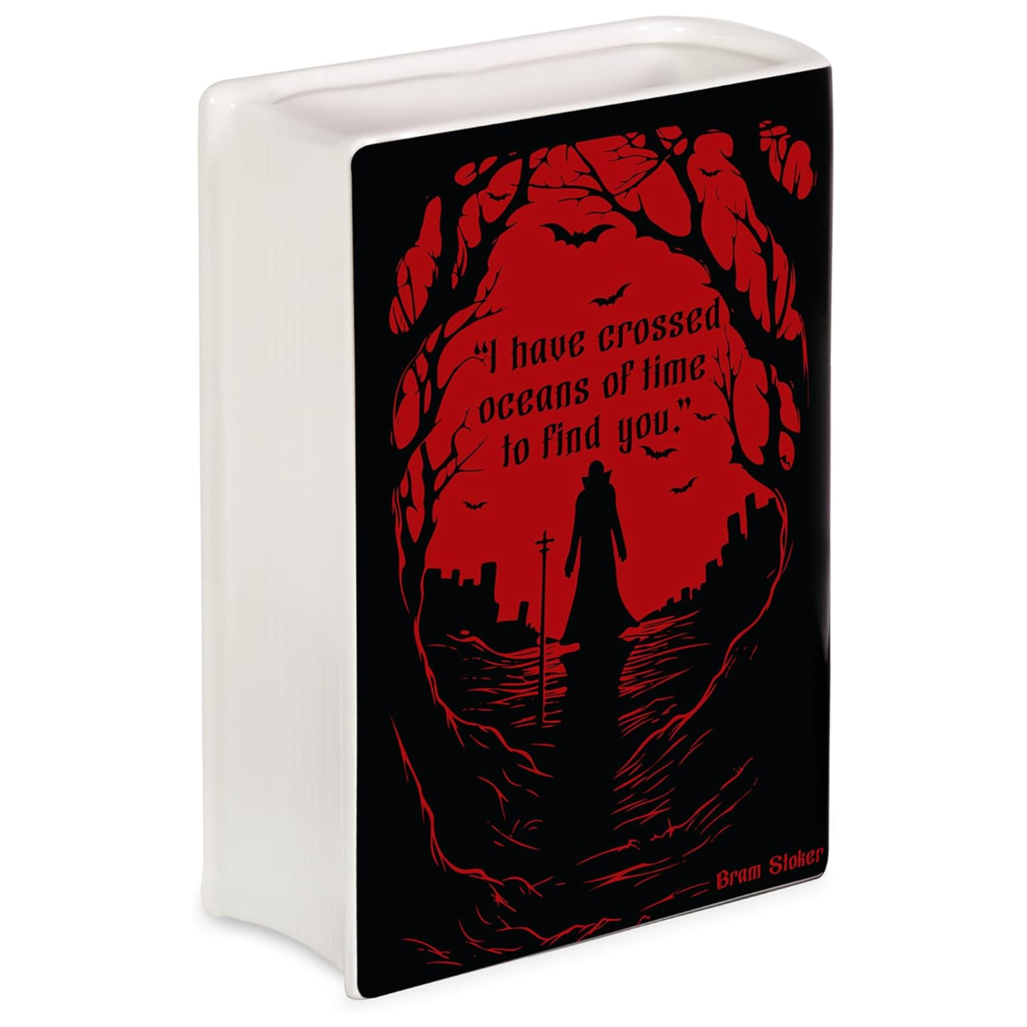A ceramic book shaped vase with a printed black and red front panel featuring a gothic silhouette scene and the quote, 'I have crossed oceans of time to find you' by Bram Stoker.