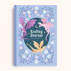 Reading journal cover with dragons and floral design on a light blue background