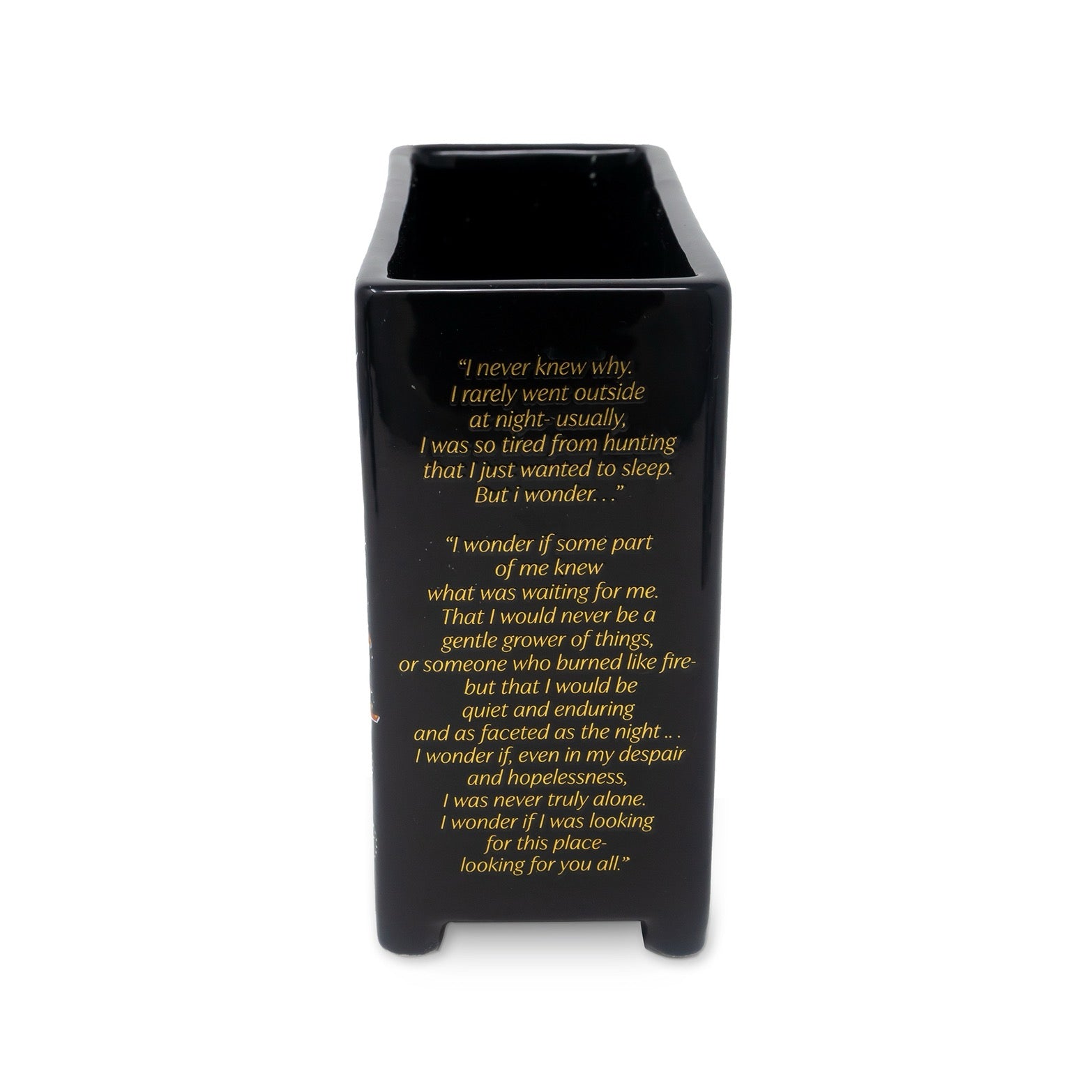 Black vase with yellow text on a white background