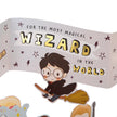 Cartoon character on a broomstick with text 'For the most magical wizard in the world' on a white background