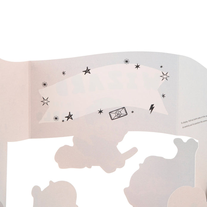 Inside card with black star and moon designs on a white background