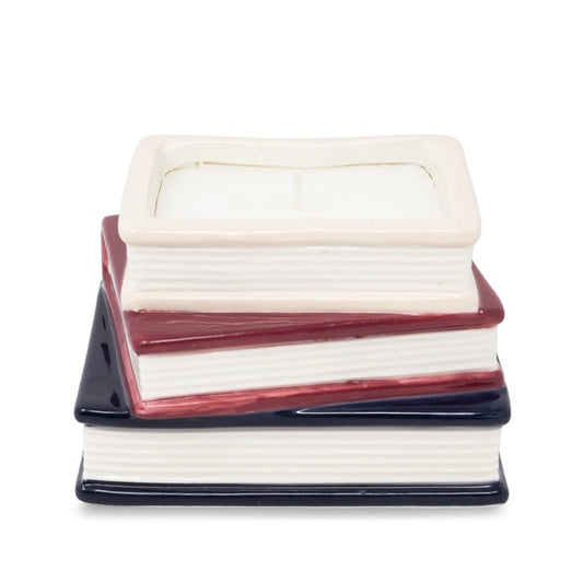 Stack of ceramic books with white, red, and blue covers on a white background