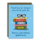 Greeting card with books and glasses illustration on a blue background