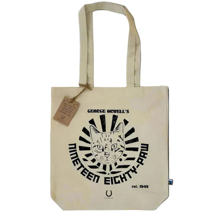 Beige tote bag with a black graphic design and text on a white surface