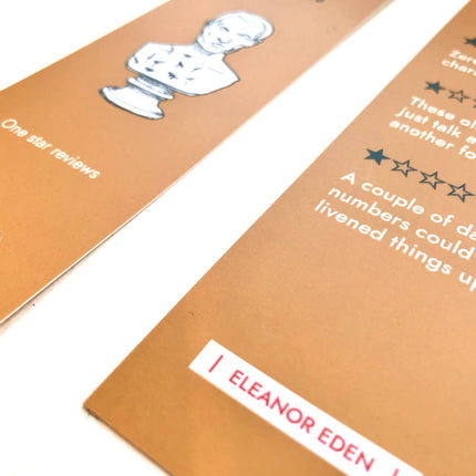 Close-up of a bookm with text and a character illustration on a white backgroundrk