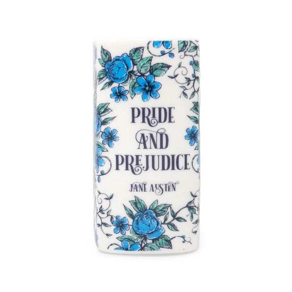 Book shaped candle of 'Pride and Prejudice' by Jane Austen with floral design on a white background