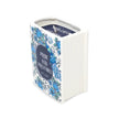 Book-shaped candle container with floral design and text on a white background