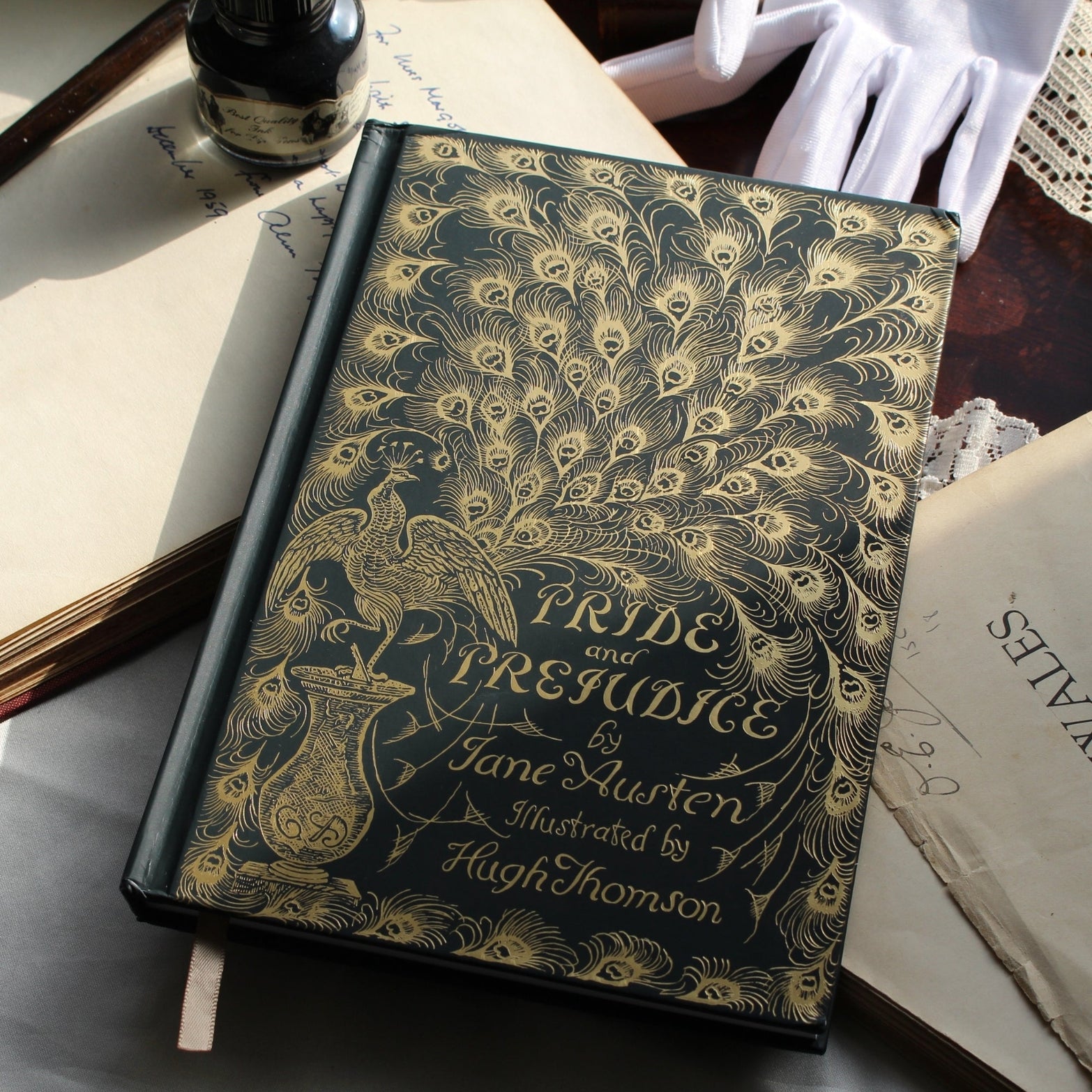 Decorative book cover of 'Pride and Prejudice' by Jane Austen with peacock feather design.