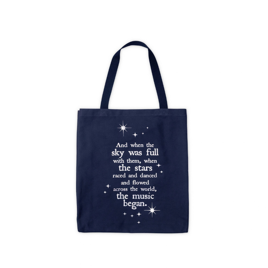A navy blue canvas tote bag with white printed text and star graphics on the front, displayed against a solid white background.