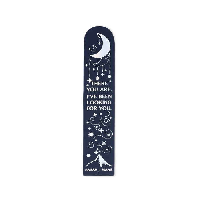 A bookmark with a navy blue background, featuring white celestial illustrations of a crescent moon, stars, and a mountain, along with the quote 'THERE YOU ARE. I'VE BEEN LOOKING FOR YOU.