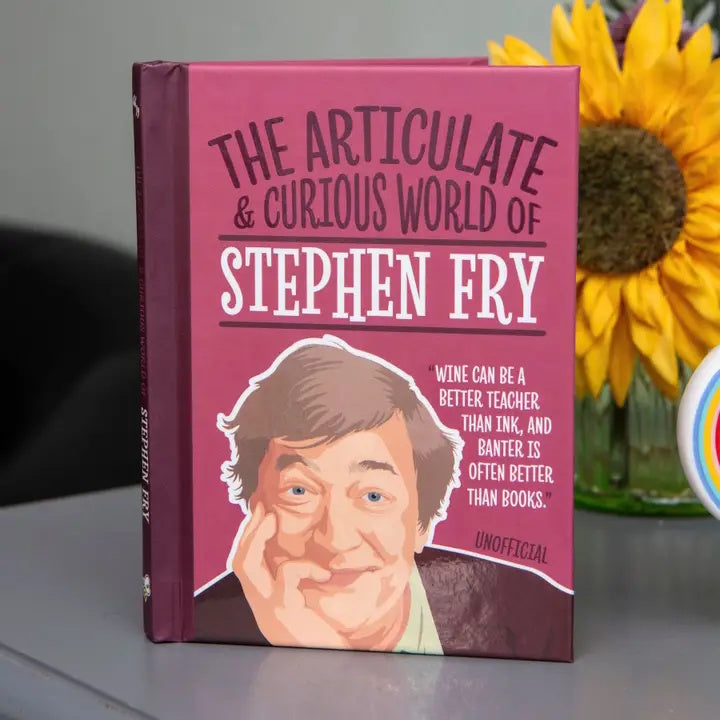 Book titled 'The Articulate & Curious World of Stephen Fry' with a portrait of Stephen Fry on a pink background.