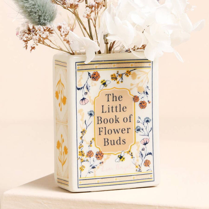 Decorative box labeled 'The Little Book of Flower Buds' with floral design on a light background