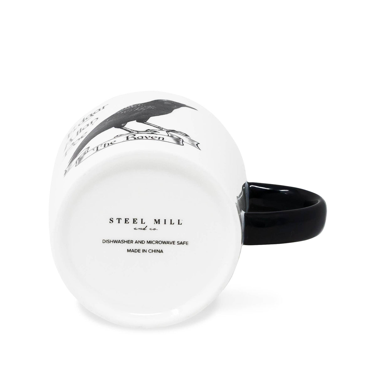 A white ceramic mug with a glossy black handle, shown from a side angle. The bottom of the mug features a black printed illustration of a raven and the text 'The Raven', while the inside bottom is marked 'STEEL MILL' and 'DISHWASHER AND MICROWAVE SAFE'.