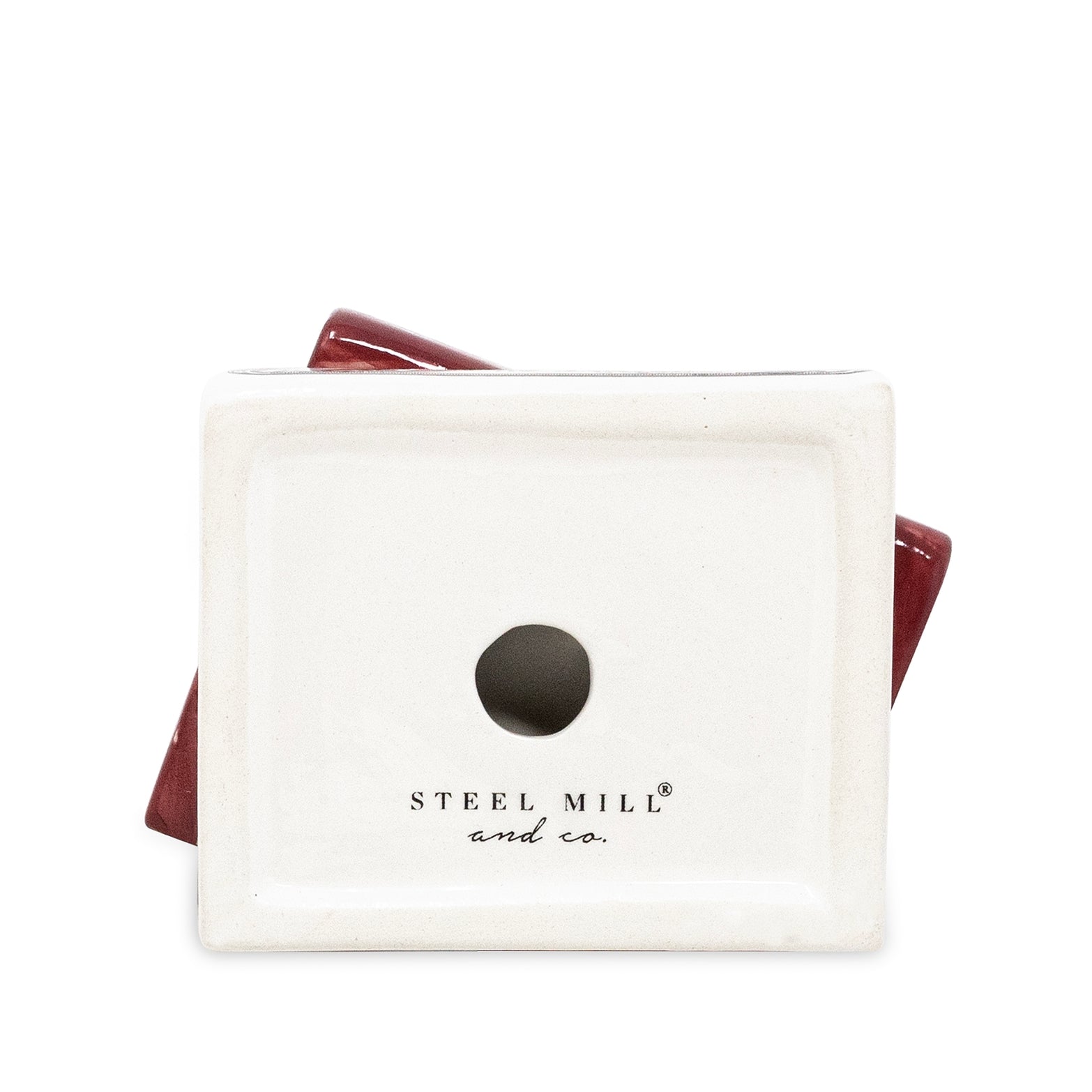 A square off-white ceramic candle holder bottom with a circular hole in the center, featuring the 'STEEL MILL and co.' brand name printed below.