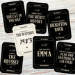 Collection of book-themed cards on a wooden surface