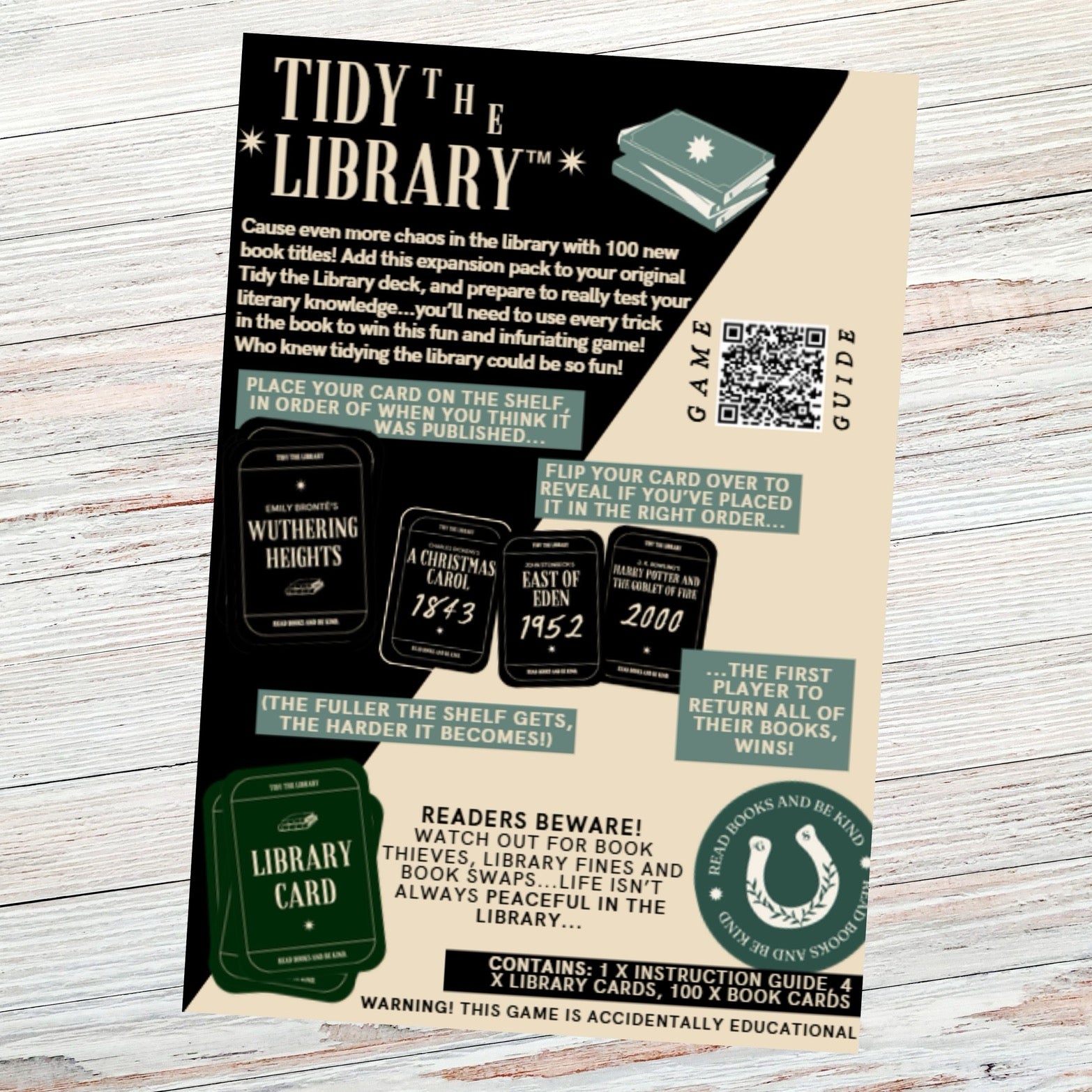 Game packaging for 'Tidy the Library' with text and graphics on a wooden surface
