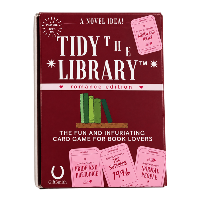 Tidy the Library: Romance Edition card game box by GiftSmith, featuring a deep burgundy cover with white title text, pink romance ticket graphics, and an illustration of green and tan books.