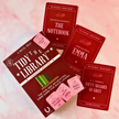Card game packaging titled 'Tidy the Library' with book-themed cards on a pink background