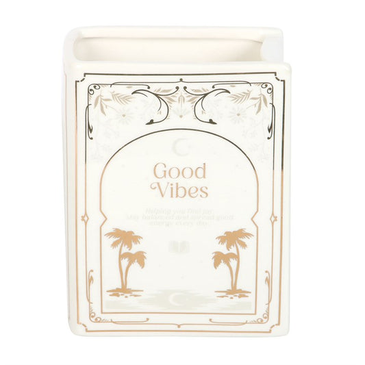 Book shaped vase with 'Good Vibes' text and palm tree designs on a white background