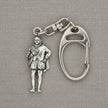 A silver-tone metal keychain featuring a detailed miniature figure of a historical man in Renaissance clothing, attached to a carabiner clip, displayed on a bright blue satin fabric background.