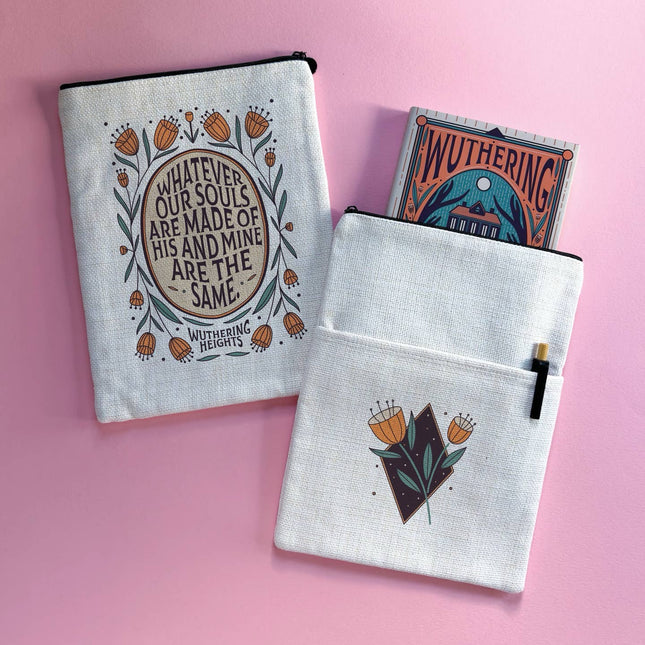Two white pouches with artistic designs and text on a pink background