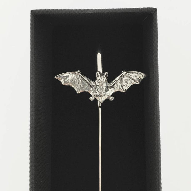 A silver bat-shaped bookmark with spread wings mounted on a straight pin, displayed inside a black presentation box against a white background.